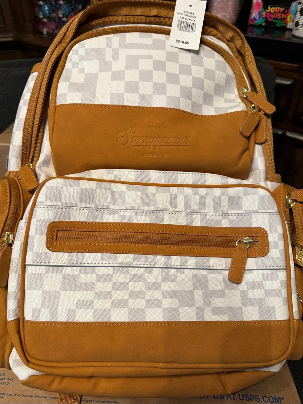 Sprayground White Checkered Backpack with Tan Accents and Gold Hardware